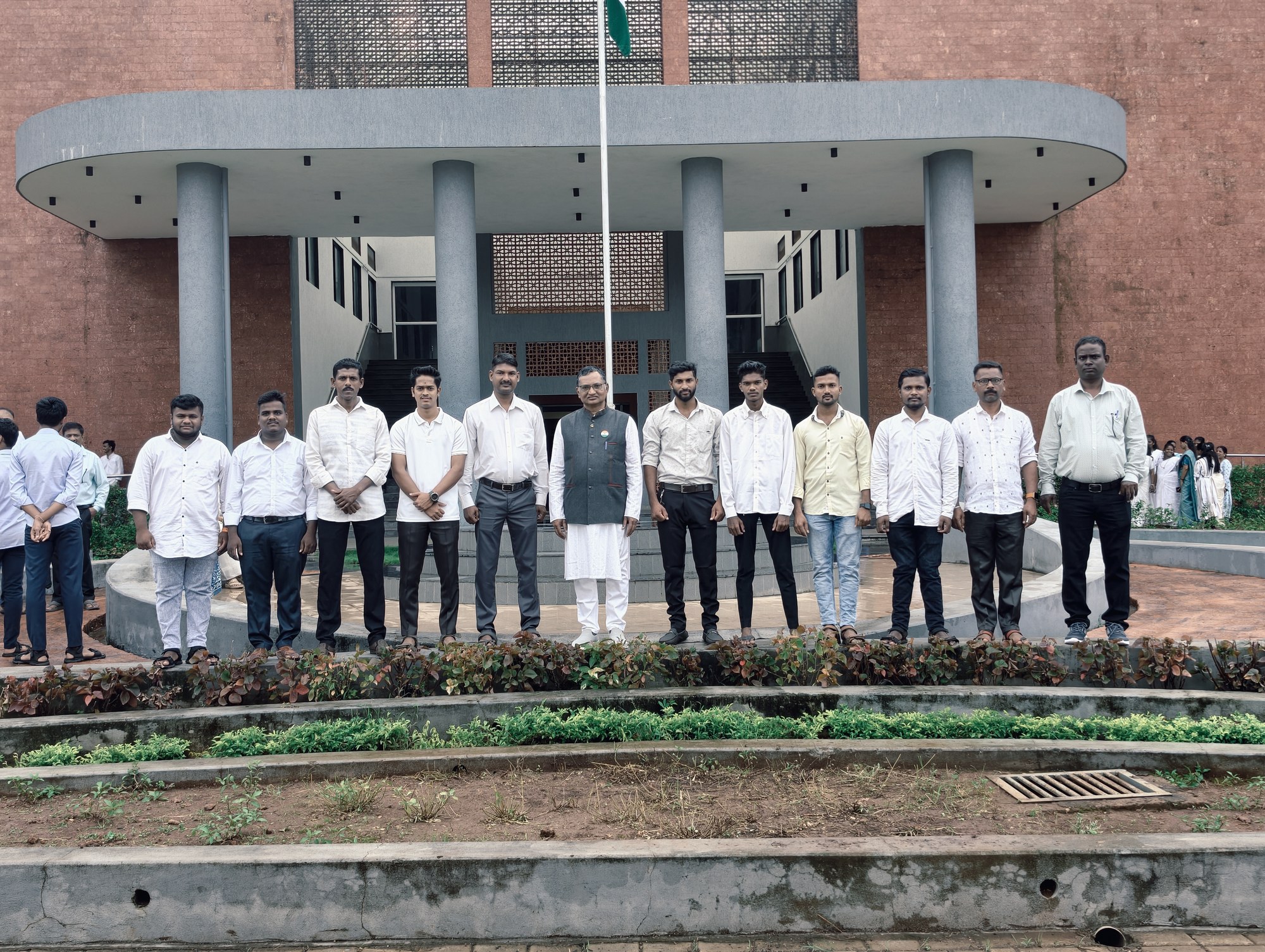 College main building facade with national flag and security staff on 80th Independence Day at LSPGCOER Ratnagiri